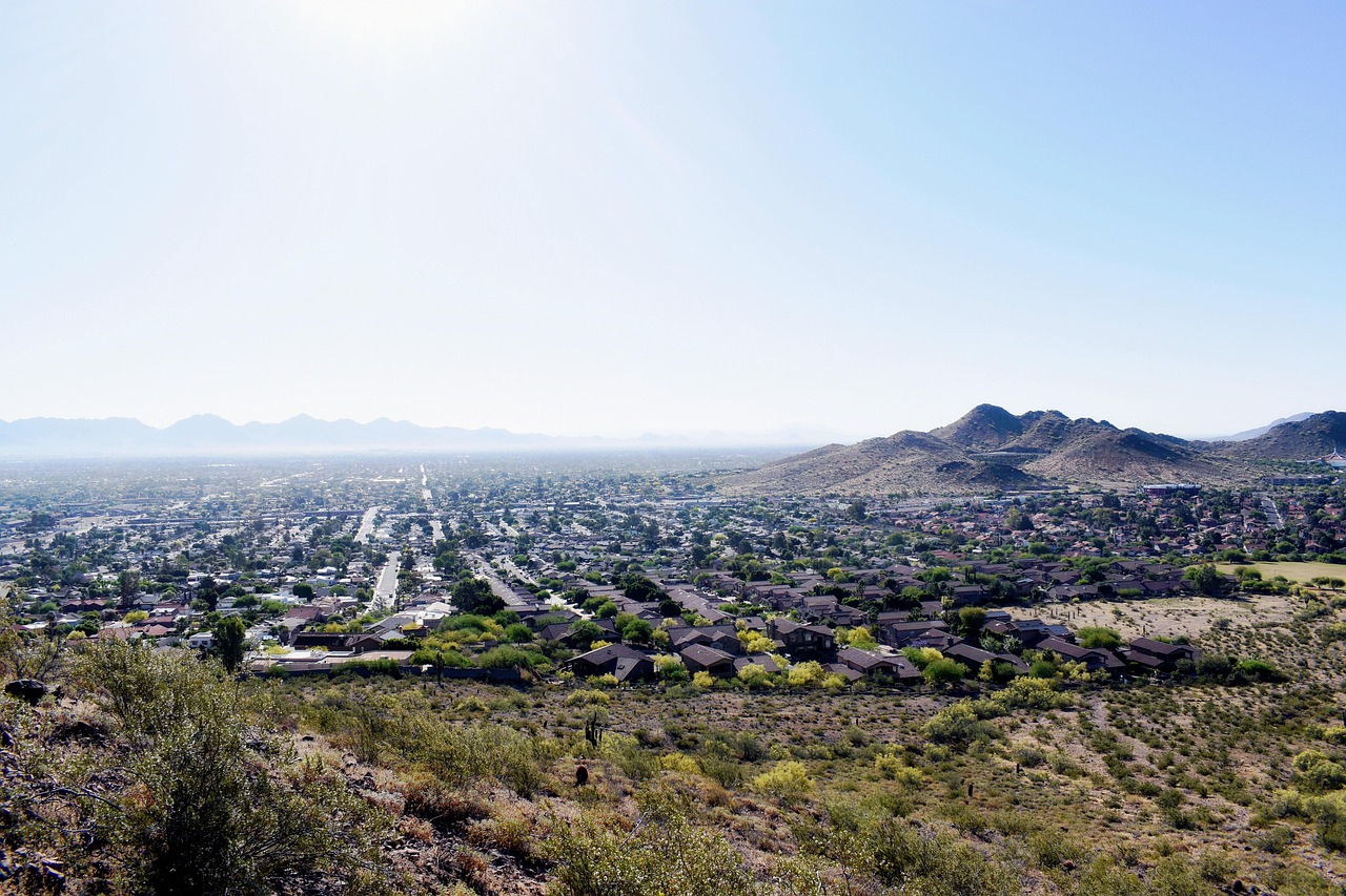 Aerial perspective of Phoenix area residential neighborhoods with the desert landscape in the background